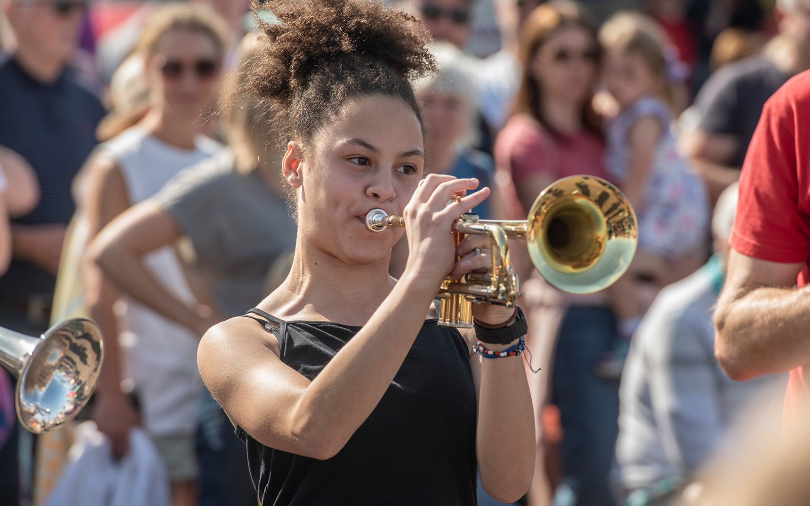 A young woman playing the trumpet