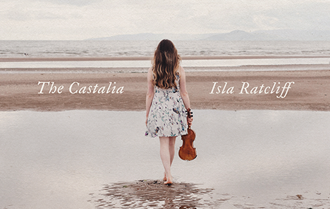 Image shows a woman in the centre of frame walking barefoot on a beach, her back to the camera. She is holding a fiddle in her right hand. The text reads The Castalia Isla Ratcliffe.