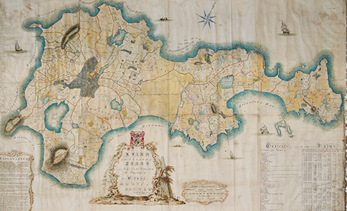 A full-colour hand illustrated map of Tiree shows the island as illustrated by James Turnbull in the 18th century. The map looks aged with wrinkles in the pages