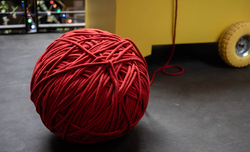 In Kind - ball of red string