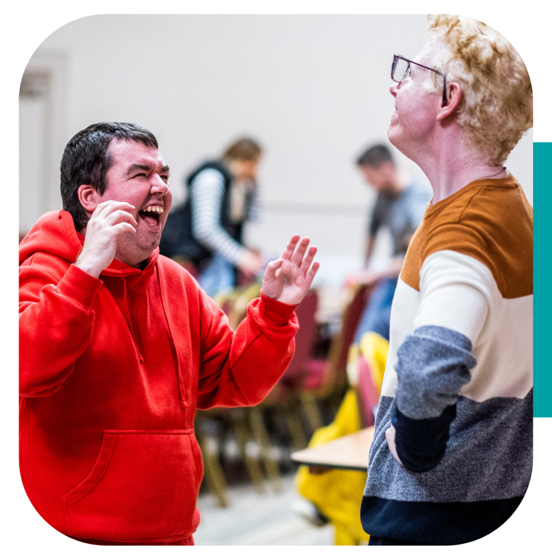 Text that says The National Lottery Awards for All is changing with an image of two people smiling and joking with each other