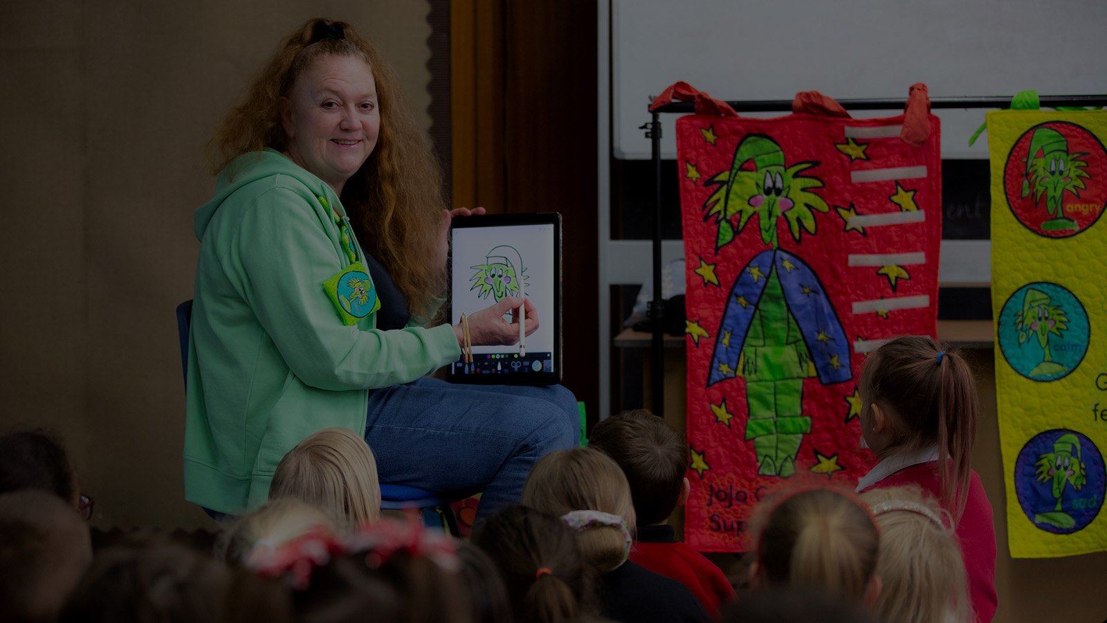 JoJo Gnome performing in a classroom