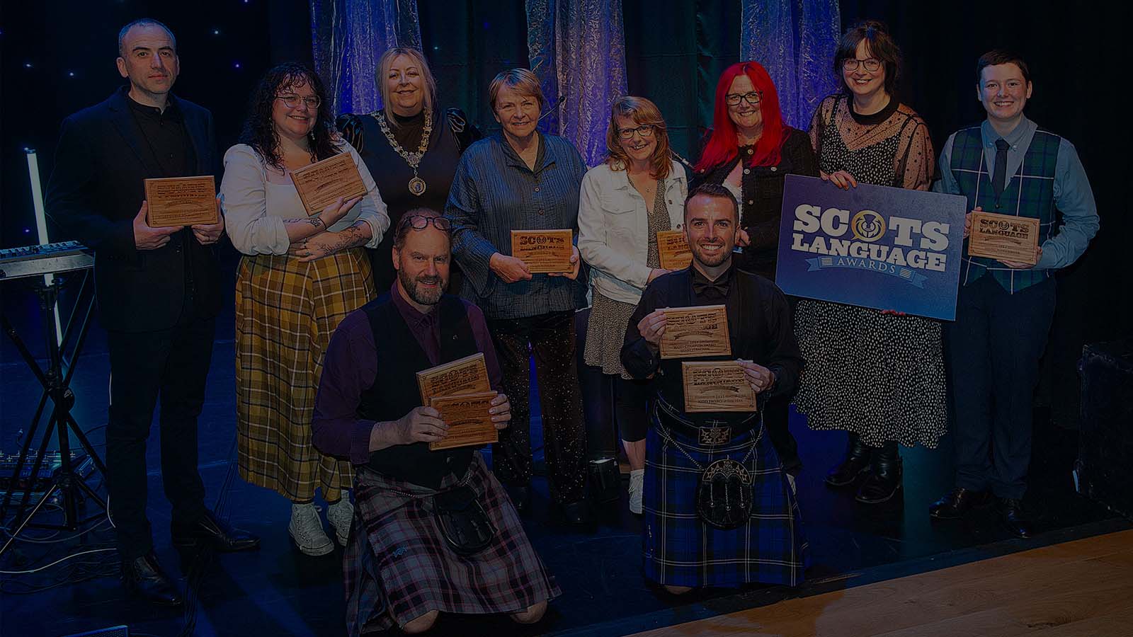The winners of the Scots Language Awards 2023 posing with their trophies