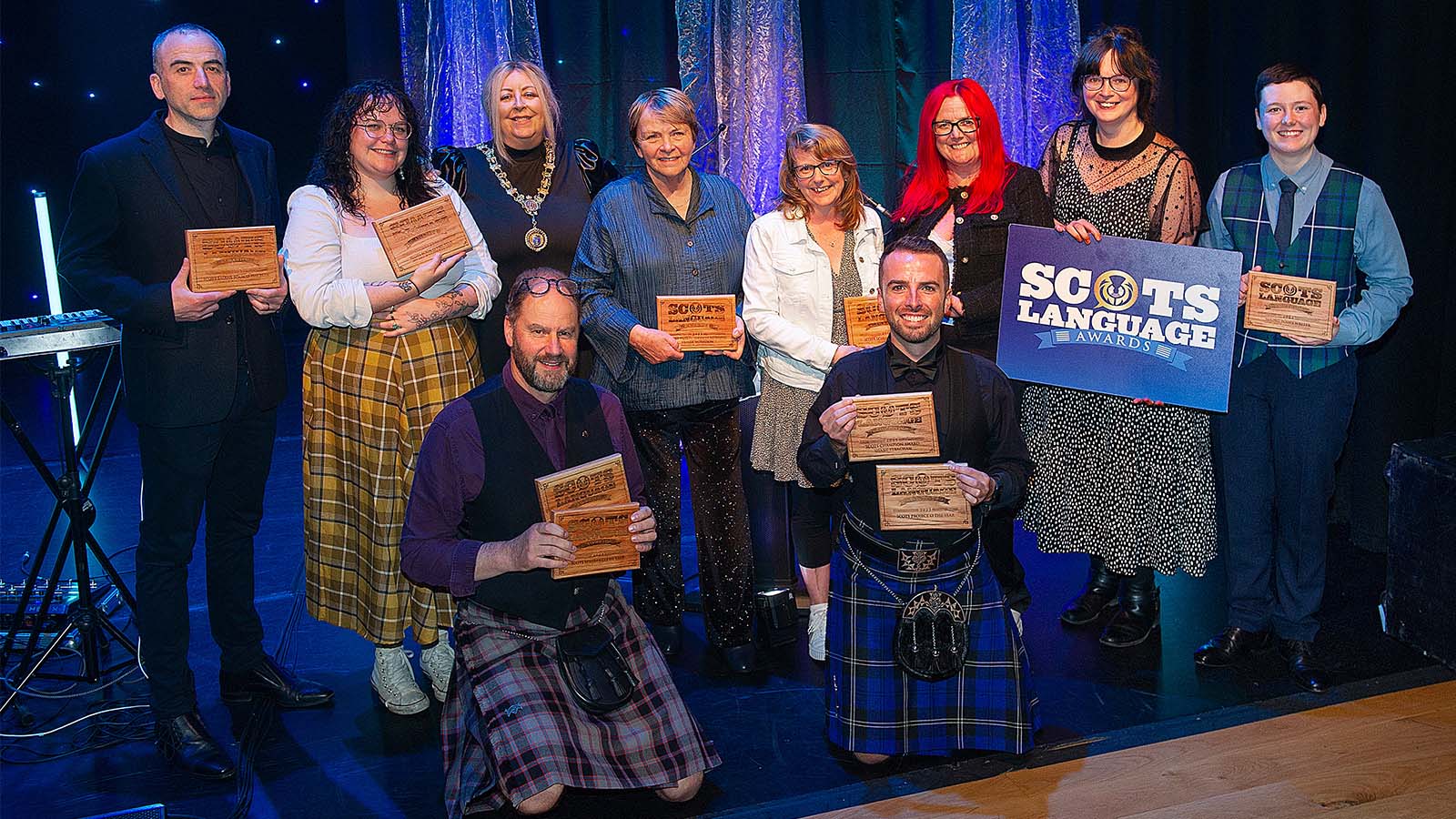 The winners of the Scots Language Awards 2023 posing with their trophies