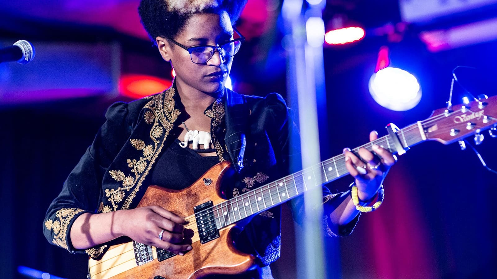 Musician Beldina Odenyo. A woman playing the electric guitar.