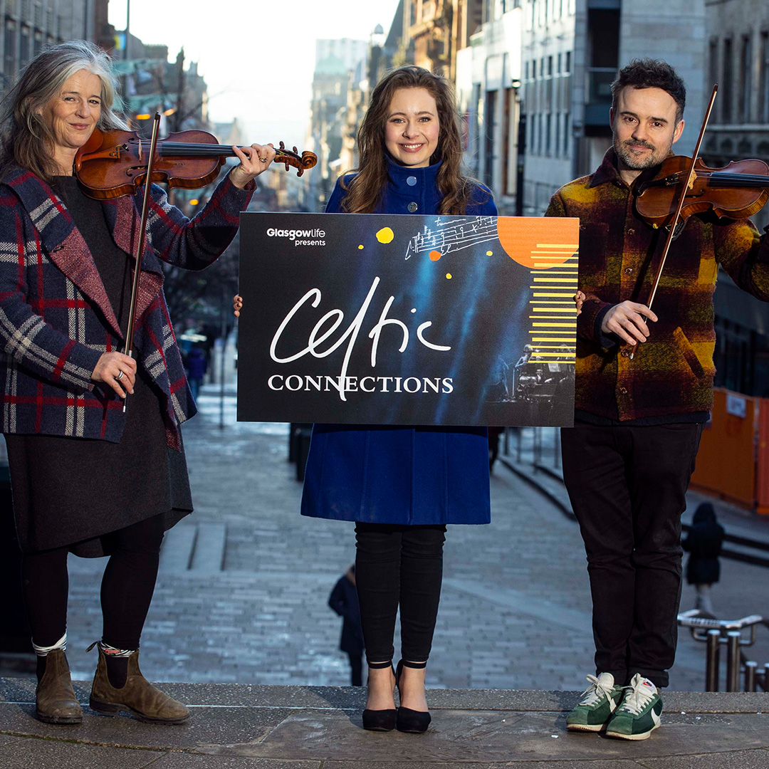 Violinist Joanne Green, Gaelic singer Mischa Macpherson and fiddle player Donald Grant gather on the steps of Glasgow Royal Concert Hall on Thursday 18 January for the opening of Celtic Connections 2024.